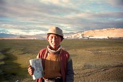 
A Local Boy Carries His Books On His Way To School In Tingri
